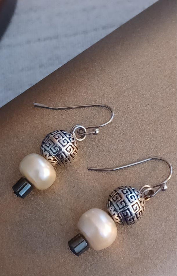 minimalist posh pearl earrings front view