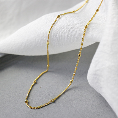 minimalist gold small bead choker necklace front view